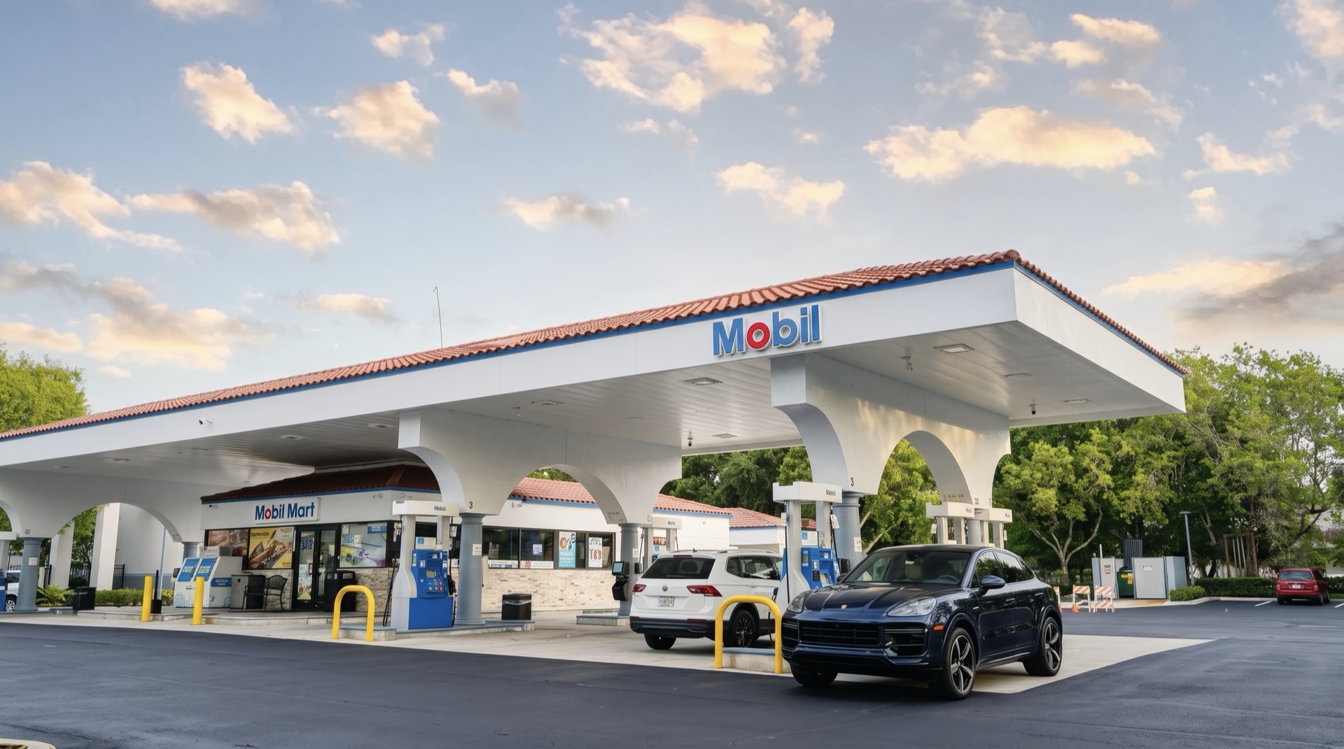 A branded Mobil station and convenience store on a South Florida forecourt at dusk